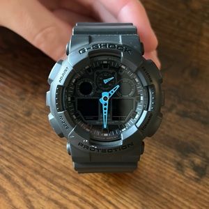 Mens G-SHOCK (GA100C-8A) Watch with blue hands